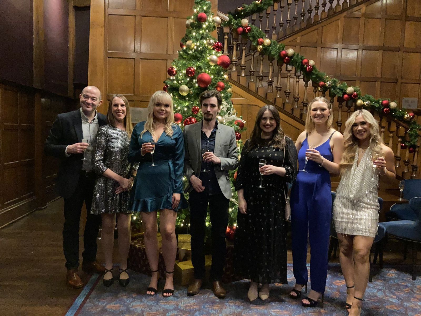 Team photo in front of the Christmas tree